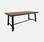 Tisch aus dunklem Holz mit Walnuss-Effekt, schwarzer Stahl  | sweeek