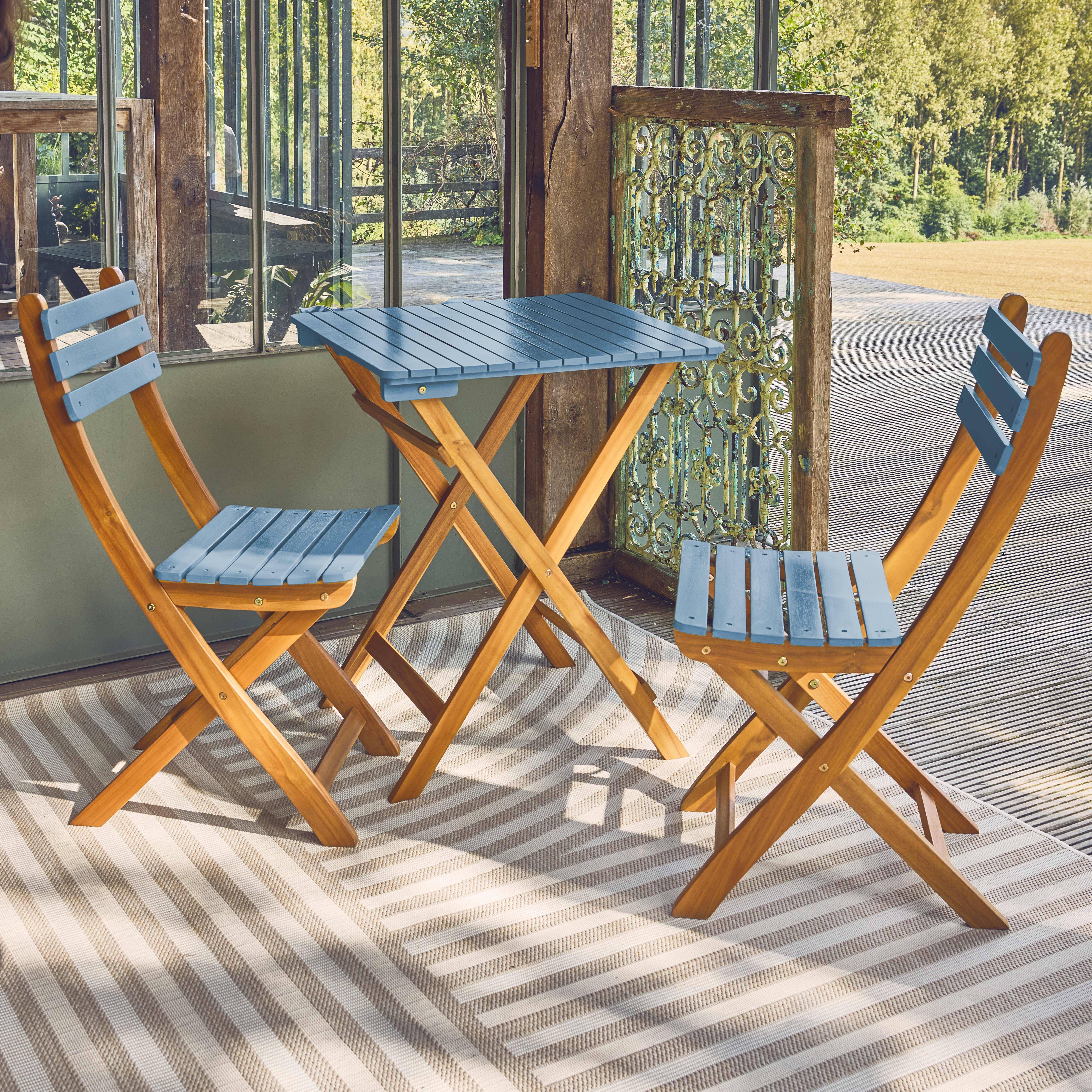 Table de jardin en bois d'acacia bleu, 2 chaises pliables HILORA , table carrée Photo1